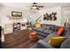 Open living room featuring stylish decor, hardwood floors and staircase at 3070 Jardin Nw Ln, Kennesaw, GA 30152
