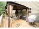 Inviting covered patio featuring stylish outdoor furniture, perfect for relaxing and entertaining guests at 3070 Jardin Nw Ln, Kennesaw, GA 30152