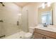 Modern bathroom features a sleek glass shower, contemporary vanity, and stylish fixtures at 3962 Adler Cir, Buford, GA 30519