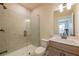 Modern bathroom features a sleek glass shower, contemporary vanity, and stylish fixtures at 3962 Adler Cir, Buford, GA 30519