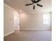 Spacious bedroom features new carpet, a ceiling fan, and white trim at 3962 Adler Cir, Buford, GA 30519