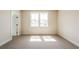Well-lit bedroom featuring carpet floors and a large double-hung window at 3962 Adler Cir, Buford, GA 30519