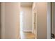 Bright hallway featuring wood-look floors and neutral paint at 3962 Adler Cir, Buford, GA 30519