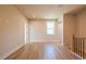 Open hallway featuring wood-look floors and neutral paint at 3962 Adler Cir, Buford, GA 30519
