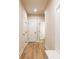 Hallway with wood-look flooring and white trim at 3962 Adler Cir, Buford, GA 30519