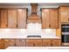 Modern kitchen featuring wooden cabinets, stainless steel appliances, and light countertops at 3962 Adler Cir, Buford, GA 30519