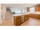 Open-concept kitchen with large island, stainless steel appliances, and hardwood floors at 3962 Adler Cir, Buford, GA 30519