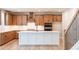 Contemporary kitchen featuring an island, wooden cabinets, and stainless steel appliances at 3962 Adler Cir, Buford, GA 30519