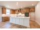 Modern kitchen featuring an island, stainless steel appliances, and ample cabinet space at 3962 Adler Cir, Buford, GA 30519