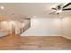 Bright, open living room with hardwood floors, recessed lighting, and staircase to the left at 3962 Adler Cir, Buford, GA 30519