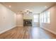 Modern living room features a fireplace, hardwood floors, ceiling fan, and recessed lighting at 3962 Adler Cir, Buford, GA 30519