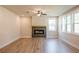 Open living room features a modern fireplace, large windows, and a ceiling fan at 3962 Adler Cir, Buford, GA 30519