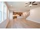 Open-concept living room with abundant natural light and a view of the kitchen at 3962 Adler Cir, Buford, GA 30519