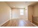 Spacious loft with wood floors, and a wooden stair rail with iron balusters at 3962 Adler Cir, Buford, GA 30519
