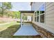 Covered patio offers a serene outdoor space and complements the architectural design of the house at 3962 Adler Cir, Buford, GA 30519