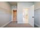Walk-in closet with wire shelving, and passage to a laundry room and an ensuite bath at 3962 Adler Cir, Buford, GA 30519