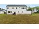 Spacious backyard with a patio and ample green space perfect for outdoor activities at 137 Bastian Rd, Mcdonough, GA 30252