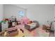 Colorful bedroom featuring carpet, single bed, play area, and toys at 137 Bastian Rd, Mcdonough, GA 30252