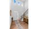 Grand foyer with soaring ceilings, wood floors, and staircase at 137 Bastian Rd, Mcdonough, GA 30252
