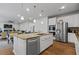 Open kitchen featuring an island, stainless appliances, and stone countertops at 137 Bastian Rd, Mcdonough, GA 30252