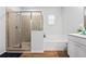 Bathroom featuring a glass-enclosed shower, separate tub, vanity, and tile flooring at 137 Bastian Rd, Mcdonough, GA 30252