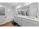 Bright bathroom showcasing a soaking tub, glass-enclosed shower, dual sinks, and vanity with drawers at 137 Bastian Rd, Mcdonough, GA 30252