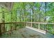 Outdoor deck space provides a serene retreat surrounded by lush greenery and mature trees at 1842 Jarrett Dr, Lawrenceville, GA 30043