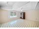Basement room with a window, patterned tile flooring, and a wardrobe at 1842 Jarrett Dr, Lawrenceville, GA 30043