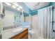 Bright bathroom with blue accents and a granite countertop vanity at 1842 Jarrett Dr, Lawrenceville, GA 30043