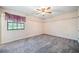 Neutral bedroom features a window with views and soft carpet at 1842 Jarrett Dr, Lawrenceville, GA 30043