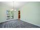 Bright dining room leading to outdoor deck overlooking green foliage at 1842 Jarrett Dr, Lawrenceville, GA 30043