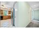 Hallway leading to the kitchen with stainless steel appliances and tile floors at 1842 Jarrett Dr, Lawrenceville, GA 30043