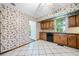 Bright kitchen with tile flooring, wood cabinets, and classic appliances at 1842 Jarrett Dr, Lawrenceville, GA 30043