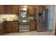 Updated kitchen featuring stainless steel appliances, granite countertops, and sleek cabinetry at 1842 Jarrett Dr, Lawrenceville, GA 30043