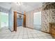 Pantry off the kitchen with white tile floors and a small storage closet at 1842 Jarrett Dr, Lawrenceville, GA 30043