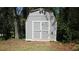 Outdoor storage shed in backyard surrounded by green landscaping at 1842 Jarrett Dr, Lawrenceville, GA 30043