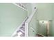 Staircase with carpeted steps and pale green painted walls at 1842 Jarrett Dr, Lawrenceville, GA 30043