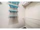 Bright walk-in closet featuring blue shelving and white wire shelving at 1842 Jarrett Dr, Lawrenceville, GA 30043