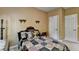 Cozy bedroom with a decorative quilt and a vintage-style headboard, offering a comfortable retreat at 2123 Floral Ridge Dr, Dacula, GA 30019