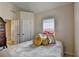Cozy bedroom featuring a twin bed, a window with blinds, and an attached bathroom at 2123 Floral Ridge Dr, Dacula, GA 30019
