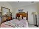 Comfortable bedroom featuring a plush bed, and classic wooden furniture at 2123 Floral Ridge Dr, Dacula, GA 30019
