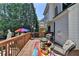 Relax on this deck and enjoy outdoor living with colorful umbrella and comfortable seating at 2123 Floral Ridge Dr, Dacula, GA 30019