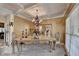 Formal dining room showcasing a large table, ornate decor, and coffered ceilings at 2123 Floral Ridge Dr, Dacula, GA 30019