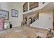 Open-concept living room with high ceilings, staircase, and views into dining area ready for renovations at 2123 Floral Ridge Dr, Dacula, GA 30019