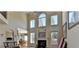 Spacious living room with high ceilings, fireplace, and ample natural light at 2123 Floral Ridge Dr, Dacula, GA 30019