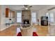 Spacious living room features a stone fireplace, hardwood floors, and lots of natural light at 2123 Floral Ridge Dr, Dacula, GA 30019