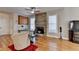 Comfortable living room with stone fireplace, hardwood floors, and cozy seating at 2123 Floral Ridge Dr, Dacula, GA 30019