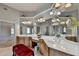 Spacious bathroom with double vanities, full mirrors, and natural light at 2123 Floral Ridge Dr, Dacula, GA 30019