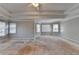 Bright main bedroom with abundant natural light, decorative tray ceiling, and multiple windows at 2123 Floral Ridge Dr, Dacula, GA 30019