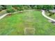 Expansive green open field with soccer goals, a walking path, and picnic tables, perfect for outdoor activities at 2123 Floral Ridge Dr, Dacula, GA 30019
